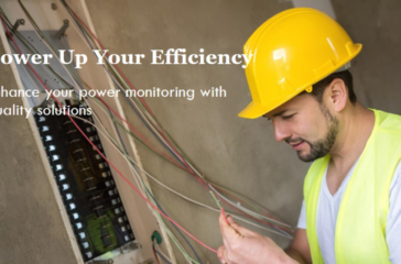 Technician with safety helmet examining Power Metering Systems in an industrial setting.