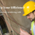 Technician with safety helmet examining Power Metering Systems in an industrial setting.