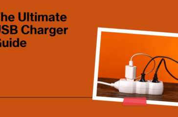 An array of USB chargers and cables plugged into a white extension cord on a wooden table against an orange background with text 'The Ultimate USB Charger Guide'.