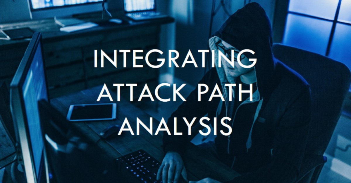 A person wearing a hoodie sitting in front of multiple computer monitors in a dimly lit room with the text “INTEGRATING ATTACK PATH ANALYSIS” overlaid.