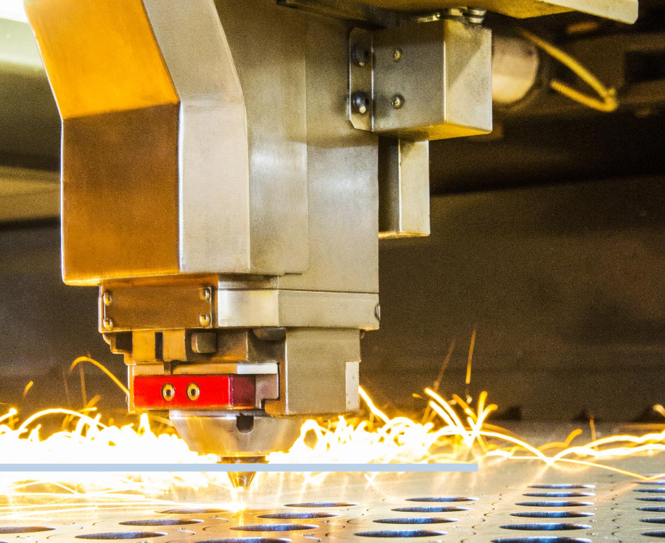 Close-up view of a precision laser cutting machine shaping a metal sheet, with sparks flying around, indicative of active work in a Sheet Metal Business.